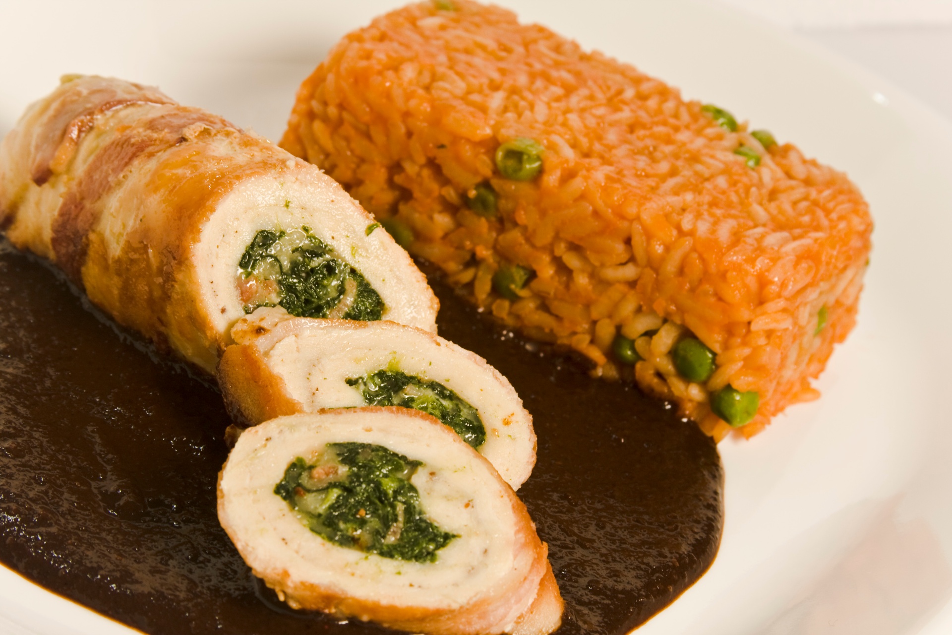 Chicken roulade with spinach, Mexican rice and mole