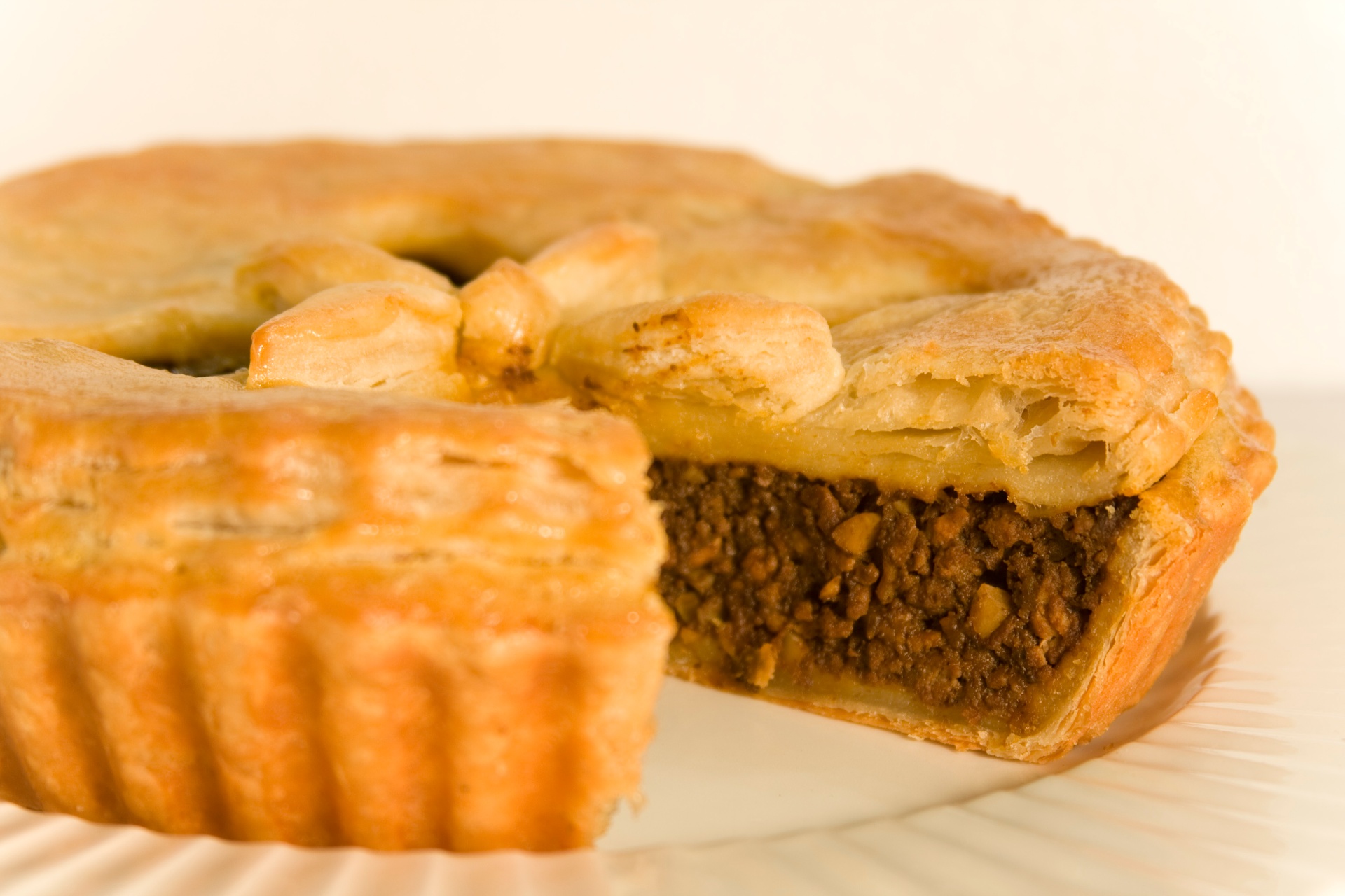 Savory meat pie prepared with seasoned filling
